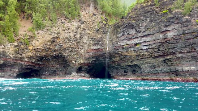 4K Hawaii Kauai Boating on ocean approaching waterfall and cave