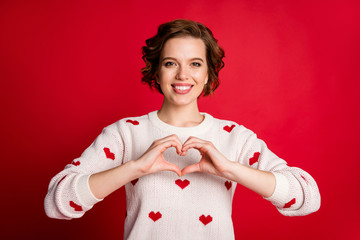 Portrait of positive cheerful girlfriend show hands chest heart passionate love sign enjoy amour...