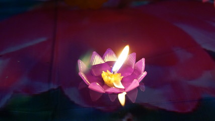 Obraz na płótnie Canvas Multi colored Krathong flower made with candles