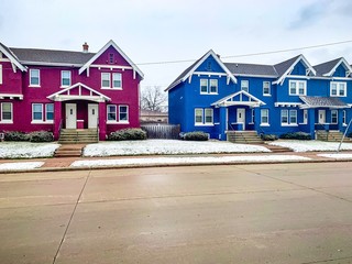 line of townhouses in winter snow