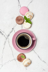 French macaroons with different flavors and cup of coffee