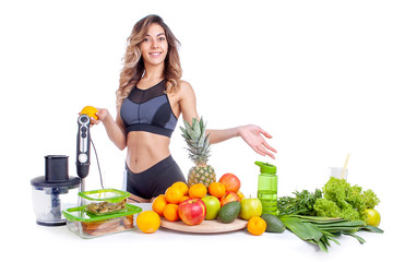 woman athlete on a white background with fruits