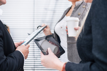 close up. group of employees discussing current tasks.