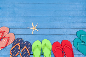flip flops on wooden blue table
