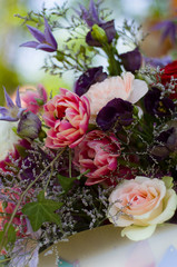 bouquet of different flowers and pink roses