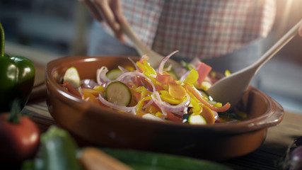 Woman preparing mixed vegetables in a bowl