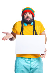 man with a beard and dreadlocks holds a white background