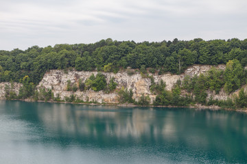 Fototapeta na wymiar Zakrzowek Lagoon, former quarry with clean azure water. Cracow, Poland.