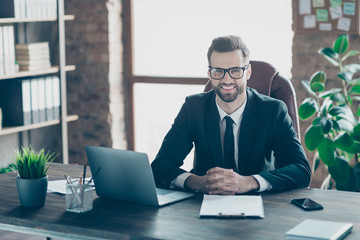Photo of handsome positive mood business guy friendly smiling listening vacancy candidate interview questions wear specs black blazer shirt tie suit sitting chair office indoors
