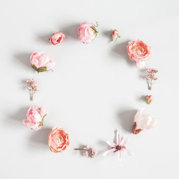 Flowers composition. Wreath made of pink flowers on pastel gray background. Valentines day, mothers day, womens day concept. Flat lay, top view, copy space, square