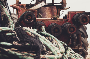 Mechanical unit pulls fishing nets. fishing background, fishing industry.