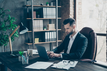 Profile photo of attentive business brunet guy looking notebook table communicating colleagues reading email letters wear blazer shirt suit sitting chair office indoors
