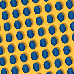 Pattern made of blue eggs on yellow or orange background. Minimal food concept.