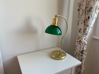 Antique green lamp on the writing desk