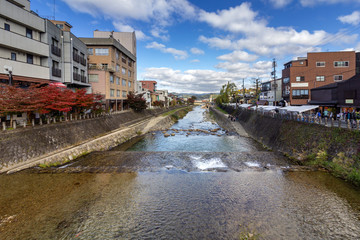 Fototapeta na wymiar Miyagawa river in Takayama, a city in the northern mountainous Hida region of Gifu Prefecture, located in the heart of the Japan Alps.