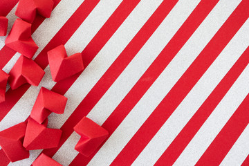 Red origami hearts on red background with silver glitter stripes. Valentine's day holiday card