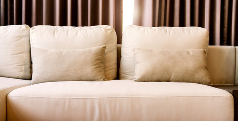 close up of soft fabric pillow decoration on beautiful sofa in living room home design concept