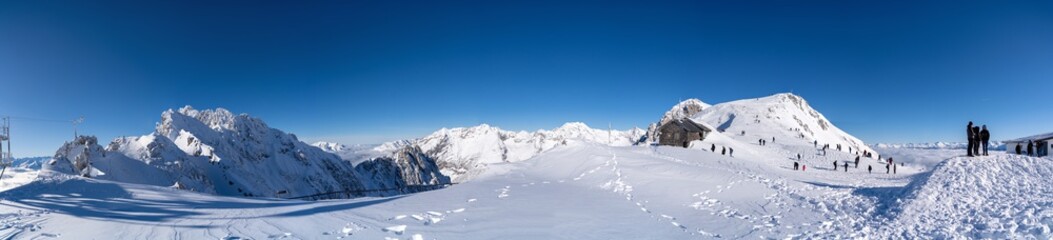 Fototapeta na wymiar Panoramic photo of the snowy peaks of the Alps