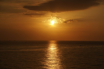 Nature seascape of Tranquil sunset scene. Sun and dark clouds with twilight sky over the sea at phuket Thailand - image backdrop background and copy space                           