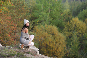 young girl on a background of the autumn landscape