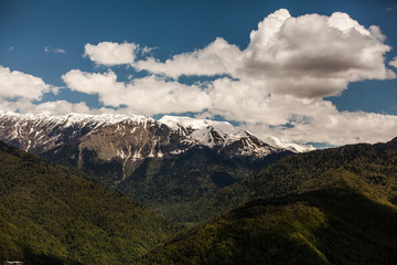 Fototapeta premium Amazing picture of green mountain landscape with blue sky and white clouds
