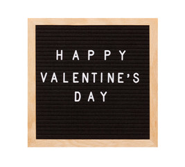 Obraz premium Valentines Day concept mockup. Happy Valentines day words on black letter board with wooden frame isolated on white background.