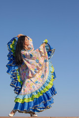 Fototapeta premium young woman dancing in gypsy dress