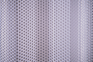 Texture of the iron bars with a metal surface and a uniform round holes