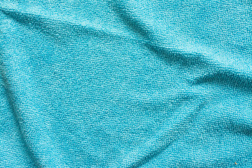 Fototapeta na wymiar Surface of blue microfiber cloth, macro textile pattern background