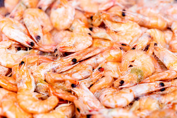 Fresh raw shrimps at market. Close up shrimps as a food background