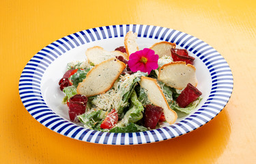 Caesar salad in Georgian with basturma and smoked Suluguni.