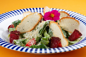 Caesar salad in Georgian with basturma and smoked Suluguni.