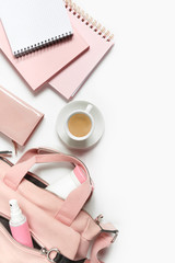 Flat lay, Women's accessories pink backpack, glider, water bottle and spray for the face on a white background, trend things girl generation z, fashion background