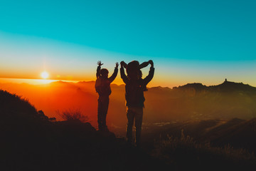 Fototapeta premium father with kids travel in sunset mountains, happy family in nature