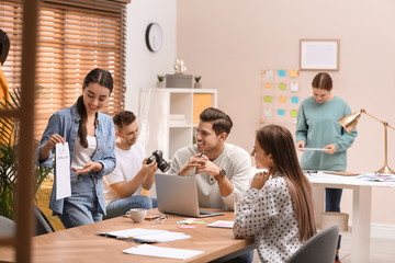 Team of professional journalists working in office