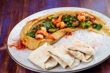 Hummus with shrimp, vegetables and homemade tortillas