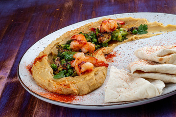 Hummus with shrimp, vegetables and homemade tortillas
