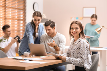 Team of professional journalists working in office