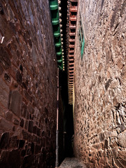 narrow and dark stone alley