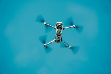 Flying drone in army camouflage skin.