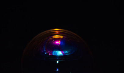 Macro of part of soap sphere on black background