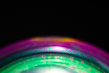 Macro of part of soap sphere on black background