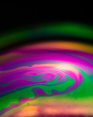 Macro of part of soap sphere on black background