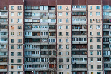 Fototapeta na wymiar facade of an old panel residential building. typical residential development of the last century. ugly, bad architecture