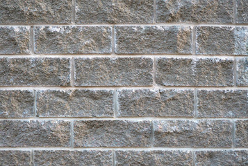 masonry of gray concrete blocks as a background