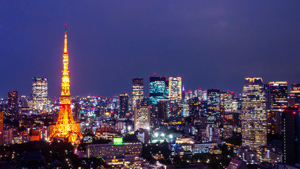 Fototapeta na wymiar Night light cityscape view with modern building in Tokyo, Japan (Public scene from the window)