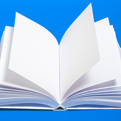 Mockup of opened blank square ctalogue at white design paper background