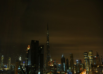 Obraz na płótnie Canvas Dubai city views during heavy rains at night from the hotel window in January 2020
