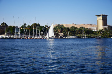 River Nile/ beautiful view for Aswan Egypt and Nubian Egyptian culture. sailing boat sailing in the...