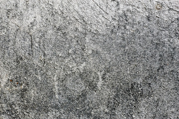 Fototapeta na wymiar Grey concrete damaged texture, wallpaper and background, close-up. Grunge rustic design, decoration and exterior or interior details concept